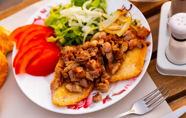 Turkish kokorec - lamb intestine food with vegetables