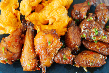 caramelized chicken with sesame and garlic, meat strips in breadin.