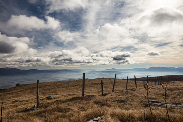 Obraz premium fence in the carinthian mountains , made for cows, looking southeast towards Slovenia.