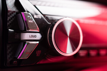 Closeup of car stereo volume controller