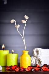 reed diffuser with candle and towel
