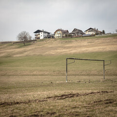 empty neglected soccer goal on an empty field
