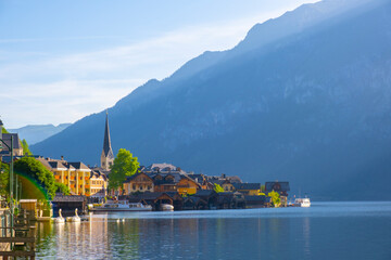 Fototapeta premium Austria, Hallstatt historical village. UNESCO world heritage site, old European architecture in sunlight. Hallstatter see in background. Hallstatt is iconic world landmark.