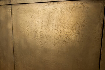 close up of golden wall at reception in luxury hotel.