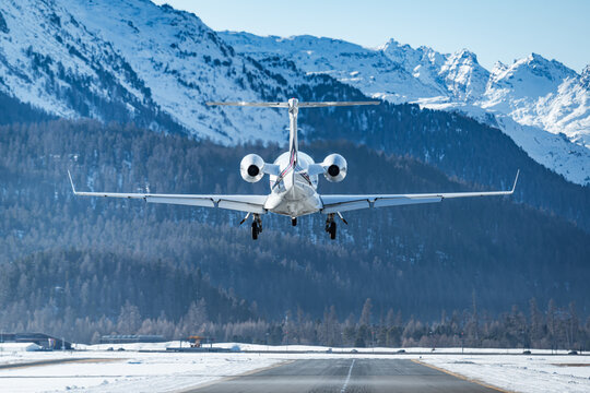 Luxurious business jet landing in the Swiss alps. Airplanes like this are the way to travel to the witner resort of St. Moritz for successful business people