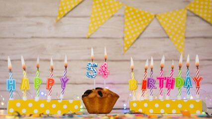 Colorful background happy birthday from the words of burning candles. Congratulation postcard...