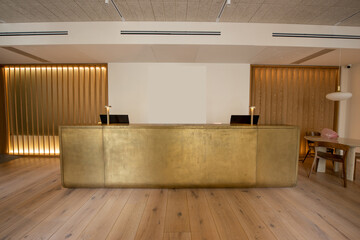 computer monitors at luxury reception desk in hotel.