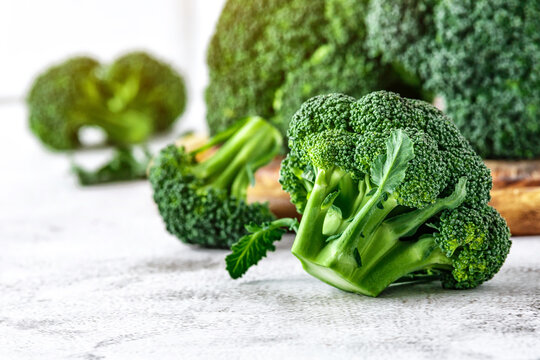Macro photo green fresh vegetable broccoli.Cauliflower and broccoli. Fresh green broccoli on a stone table.Broccoli vegetable is full of vitamin.Vegetables for diet and healthy eating.