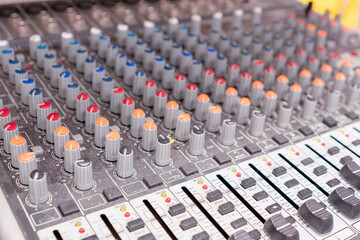 Musical instrument mixer focus on foreground.