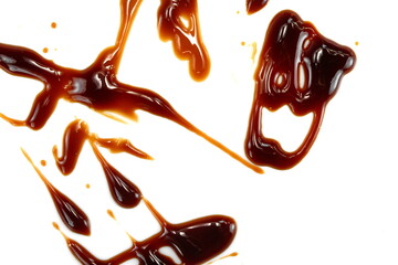 A drop of balsamic vinegar isolated on white background. Balsamic vinegar cream isolated on white background. Italian salad dressing, sauce.