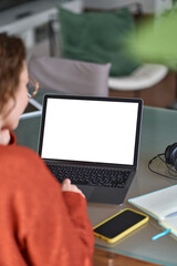 Over shoulder view of woman student elearning looking at white mock up blank screen using laptop...
