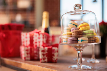 Empty living room filled with romantic presents and red roses, waiting for boyfriend and girlfriend to come and enjoy valentine s day. Home full with ballons and sparkling wine. Love holiday concept