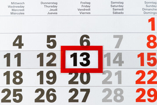 Showing friday the 13th on paper calendar.