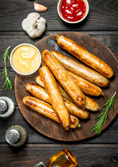 Fragrant grilled sausages with sauces and herbs.