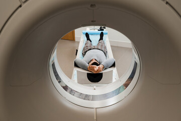CT scan of abdominal of man in medical clinic. Man is doing computed tomography x-ray examination...