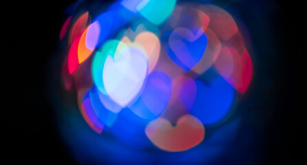 ball of colored hearts on dark background for use in graphic design
