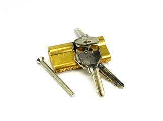 Pin tumbler of cylinder lock internal mechanism with keys on white background. New door lock with a bunch of keys on a white background.