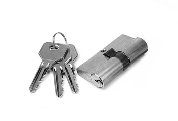 Pin tumbler of cylinder lock internal mechanism with keys on white background. New door lock with a...