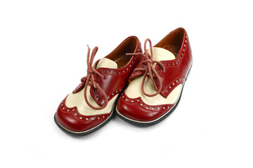 vintage red and white shoes for a little boy isolated on white.