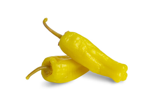 Two pickled yellow peppers, pepperoncini or friggitelli isolated on transparent background, PNG. Hot pepper marinated, brined. Traditional Italian and greek cuisine, ingredient for salad, pasta, sauce