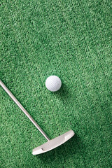 Golf Putter And Ball On Artificial Grass Background