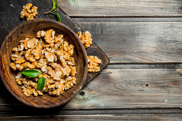 Shelled walnuts in a bowl .