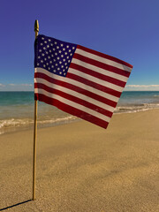 American flag on the coast of the Atlantic Ocean. American Independence Day. Liberty. Soft focus