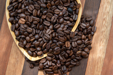 coffee beans in heart-shaped tra,y representing love of coffee