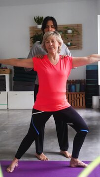 ederly oman practicing yoga in the comfort of her own space