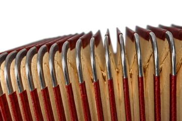 A detail of an old accordion isolated on white