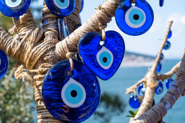 Evil eye beads closeup. Nazar beads. Turkish superstition and tourist souvenir, Grand Bazaar, Istanbul, Turkey - obrazy, fototapety, plakaty
