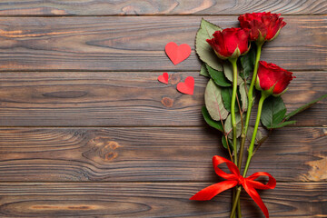 Naklejka na ściany i meble Valentine day composition with rose flower and red heart on table. Top view, flat lay, copy space Holiday concept