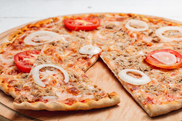 pizza with salami and tomatoes
