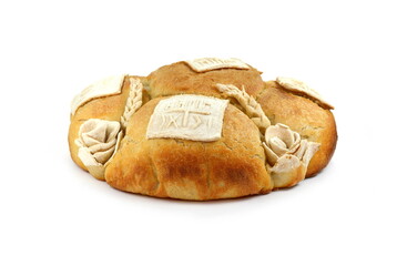 Homemade decorated Serbian slava bread isolated on white.