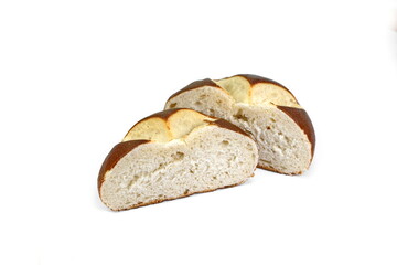 Freshly baked traditional German laugenbrot. Bavarian homemade pretzel rolls lye bread, close-up, isolated on white background.