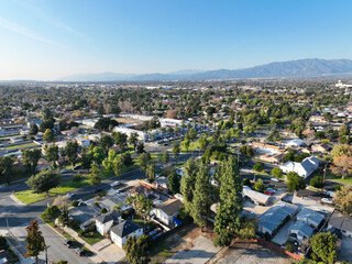 Aerial view of Ontario city in California with mountains in the background, California, USA - obrazy, fototapety, plakaty