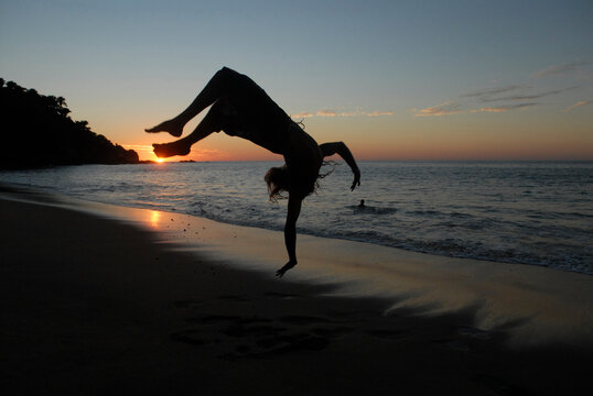 Beach jump, hand spring