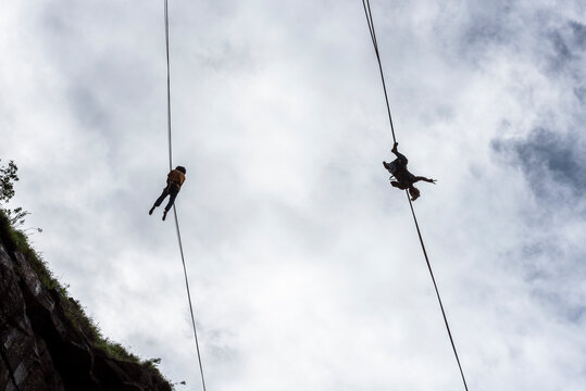 View from below of two slackliners, Dibs Quarry, Maripora, Sao Paulo State, Brazil
