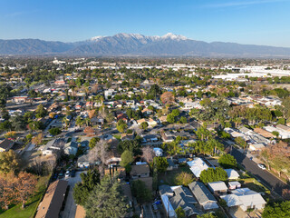 Aerial view of Ontario city in California with mountains in the background, California, USA - obrazy, fototapety, plakaty