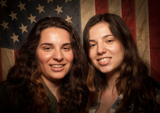 Sisters pose for a portrait as first time voters in the November 2012 United States Presidential Election for a project on new amercian voters.
