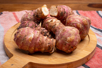 Group of fresh uncooked topinambur or Jerusalem artichoke roots