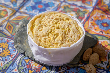 Tasting of local portuguese matured cheese queijo serpa,  Setubal area, Portugal