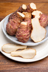Group of fresh uncooked topinambur or Jerusalem artichoke roots