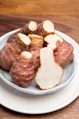Group of fresh uncooked topinambur or Jerusalem artichoke roots