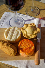 Codfish croquette pastais de bacalhau, chicken pie, variety of goat, sheep, cow cheeses made with paprika, herbs, made in Portugal