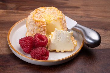 French Langres soft cows crumbly cheese with washed rind structure made in Champagne - Ardenne region