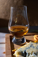 Tasting of Scottish single malt or blended whisky with English cheeses blue stilton and shropshire