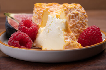 French Langres soft cows crumbly cheese with washed rind structure made in Champagne - Ardenne region