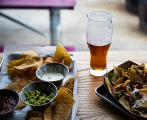Beer in class with nachos