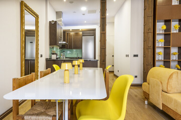 Living room of a loft vacation apartment with metal columns and modern designer furniture with...